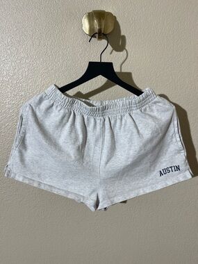 Brandy Melville grey sweat-shorts with “Austin” graphic in leg